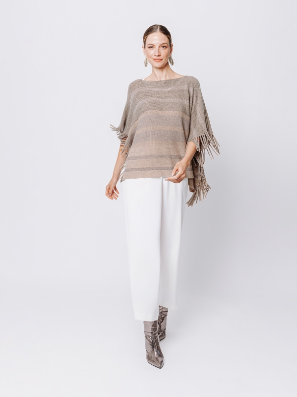 Knitted poncho with fringes