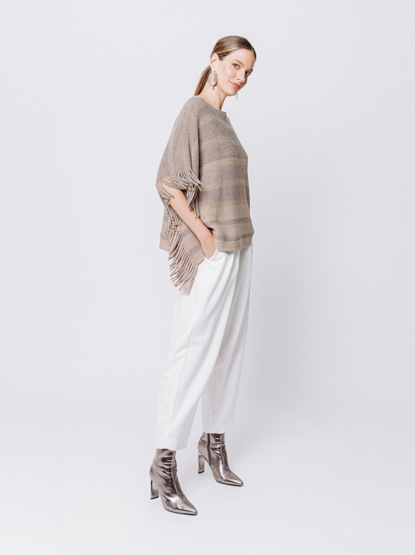 Knitted poncho with fringes