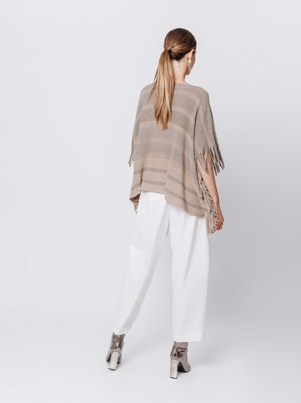 Knitted poncho with fringes