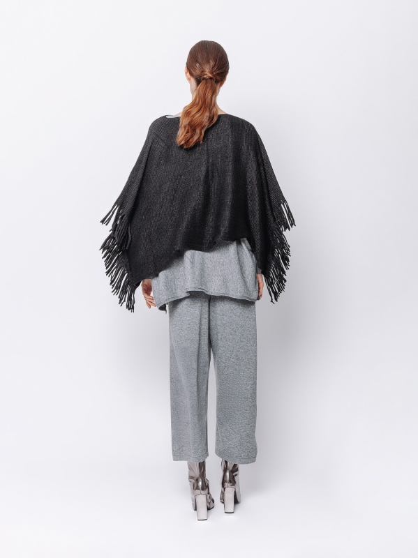 Knitted poncho with fringes