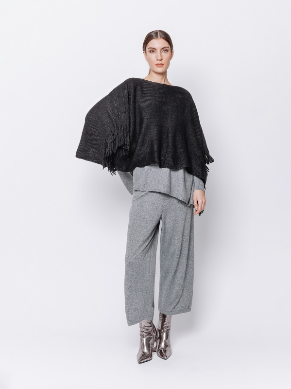 Knitted poncho with fringes